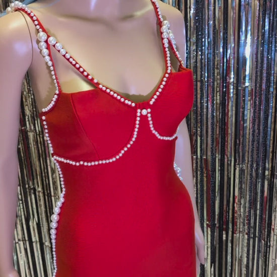 Gorgeous red dress Scarlett designed with a white pearls. The bandage style ensures a figure-hugging fit, making it the perfect choice for a special occasion.